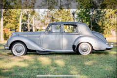 1952 Bentley R-Type LHD Automatic B450LSR Odometer: 34,432 miles. Older restoration showing very well. Tudor gray over silver; light gray/dark gray piping. Originally delivered to France; first owner purchased for his wedding tour of Europe, afterward imported to the United States. Presented as per build sheet: original colors, white walls, Pyrene bumpers with large overriders specific to few cars to the export market; repeaters without trafficators (deleted); high frequency horns; sealed beam headlights. Owners manual; all large tools with a mostly complete small tool tray. Extensive history/receipt file. A very special Early Post War Bentley.