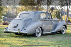 1952 Bentley R-Type LHD Automatic B450LSR Odometer: 34,432 miles. Older restoration showing very well. Tudor gray over silver; light gray/dark gray piping. Originally delivered to France; first owner purchased for his wedding tour of Europe, afterward imported to the United States. Presented as per build sheet: original colors, white walls, Pyrene bumpers with large overriders specific to few cars to the export market; repeaters without trafficators (deleted); high frequency horns; sealed beam headlights. Owners manual; all large tools with a mostly complete small tool tray. Extensive history/receipt file. A very special Early Post War Bentley.